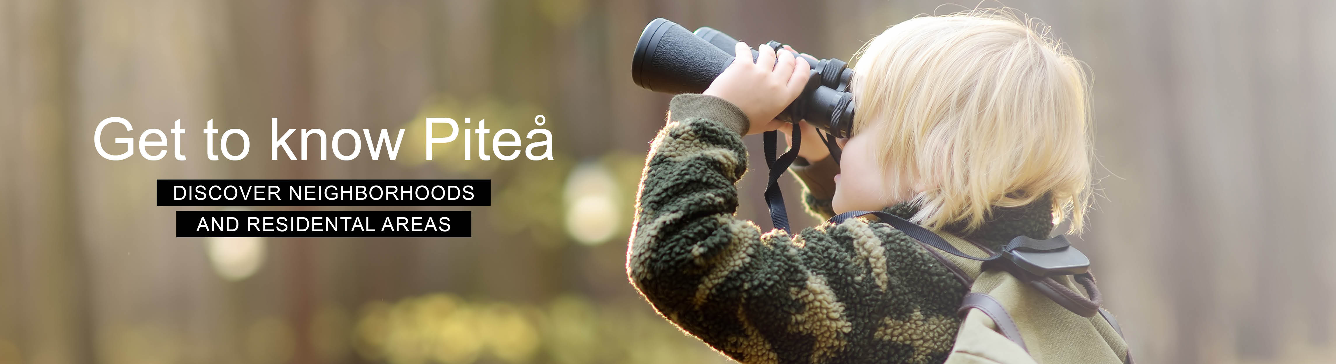 Curious child looking through binoculars